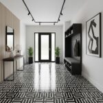 Black and white geometric patterned tile with a glossy finish, used on the floor of a contemporary entryway.
