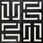 Black marble tile with white geometric pattern, smooth texture, and modern style.