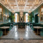 Luxurious green velvet tiles with a textured finish, complemented by gold accents and elegant chandeliers in a sophisticated.