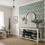 A stylish entryway with peel and stick wall tile, mirror, and decor for a modern home upgrade.