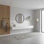 A modern bathroom featuring a shell tile wall with mother of pearl accents, complemented by minimalist decor and natural ligh.