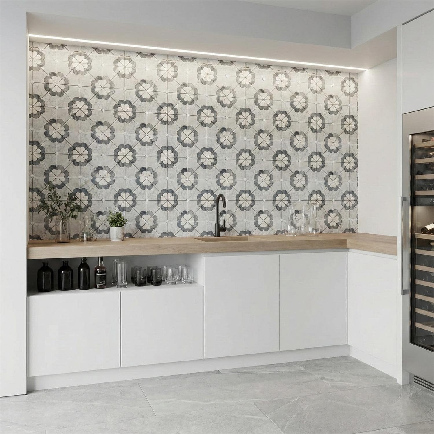 Decorative tile wall featuring a floral pattern in shades of gray and white.