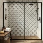 Gray and white patterned ceramic tiles, textured surface, modern floral design.