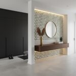 Geometric patterned tile wall in black and white, with a wooden console and round mirror, creating a stylish and contemporary.