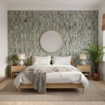 White and green textured tile wall behind bed.