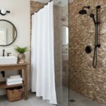 Bathroom featuring oyster shell tile wall, black shower fixtures, and a cozy, minimalist design.