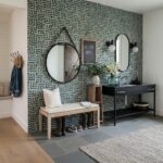 Gray and white geometric patterned tiles with a textured surface.