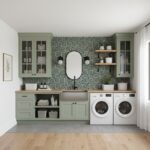 Bright, modern laundry space with green cabinets, geometric tile backsplash, and wooden shelves.