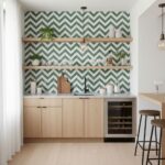 Image of a modern kitchen with green and white chevron peel and stick tile backsplash, wooden shelves, and minimalist decor.
