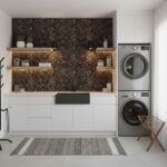 Modern laundry room with peel and stick tile backsplash, washer, dryer, and minimalist decor.
