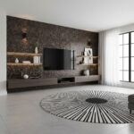 Contemporary living room featuring peel and stick wall tile behind the TV, minimalist decor, and a stylish black-and-white ru.