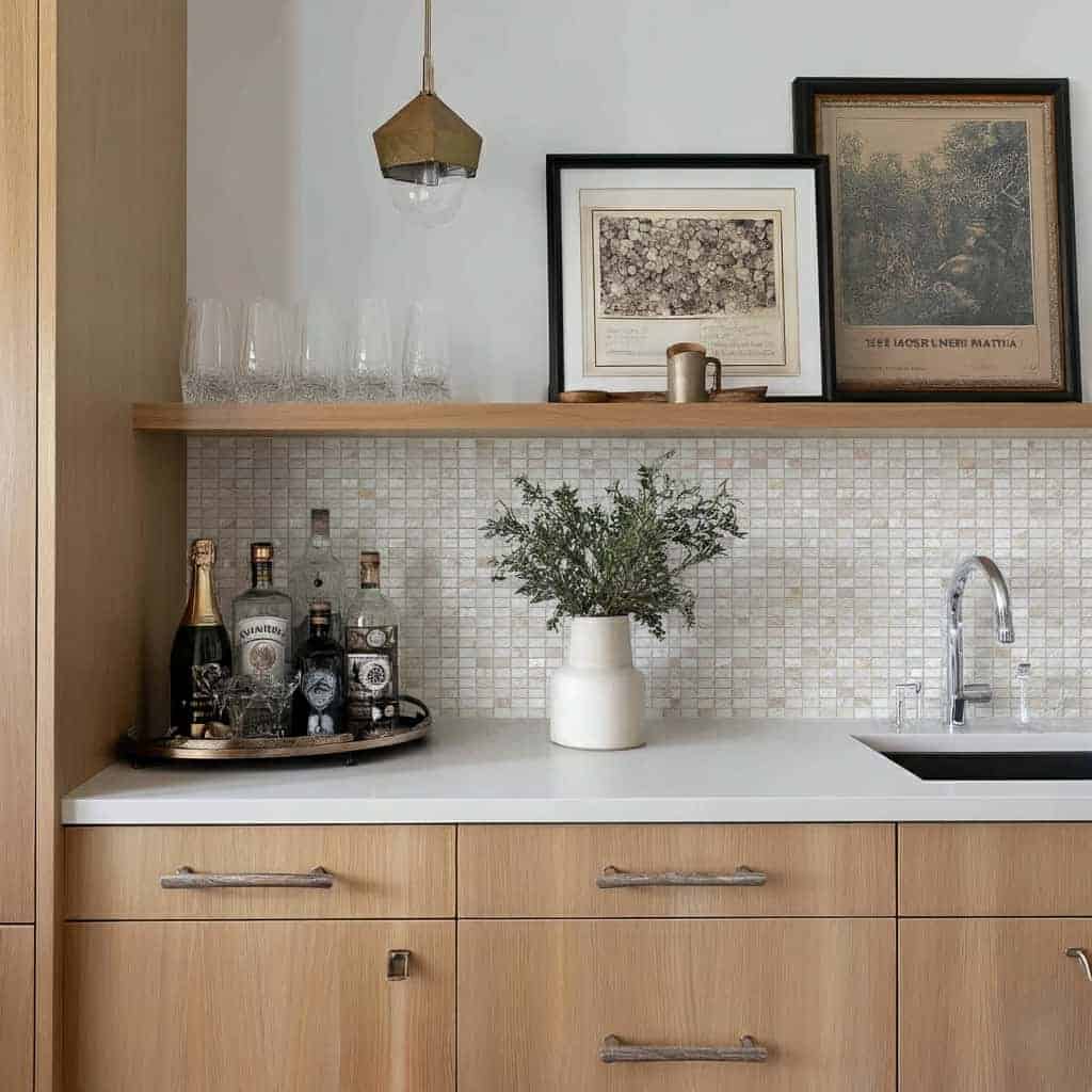 Elegant shell tile backsplash with mother of pearl accents in a modern kitchen setting.