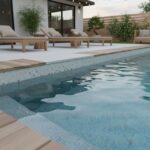 Beautiful glass tile pool with a sleek mosaic backsplash, surrounded by outdoor seating and lush plants for a relaxing backya.