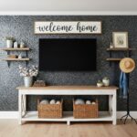 Decorative peel and stick tile wall with a "welcome home" sign and cozy accents.