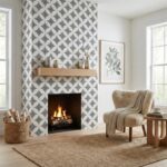 A fireplace with a black and white geometric patterned tile surround, complemented by a wooden mantel and cozy beige armchair.
