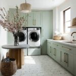 Bright mint green cabinets with smooth texture and gold handles, complemented by white hexagonal tiled flooring.