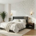 Light-colored ceramic tile with circular pattern, textured surface, modern design.