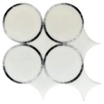 A decorative mirror mosaic featuring white tiles with black mosaic borders, arranged in a circular pattern with star-shaped a.