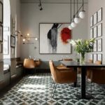 Describe tile color, texture, and pattern: Black and white geometric patterned ceramic tile with a matte finish, adding a con.