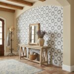 Decorative floral patterned wall tile in neutral tones with textured surface.