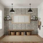 Bright, textured tile wall with neutral tones, wooden accents, and decorative shelves in a cozy entryway.