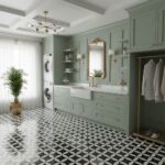 Bright bathroom with mint green cabinetry, white marble countertop, and gold fixtures, featuring a patterned black and white.