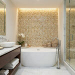 Mother of pearl shell tile in a bathroom with a bathtub and modern decor.