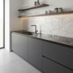 Modern kitchen with elegant mother of pearl shell tile backsplash and sleek gray cabinetry.