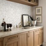 Mother of pearl shell tile used as a stylish kitchen backsplash with a natural, iridescent finish. Perfect for adding eleganc.