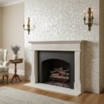 Fireplace with mother of pearl shell tile surround and elegant wall sconces.