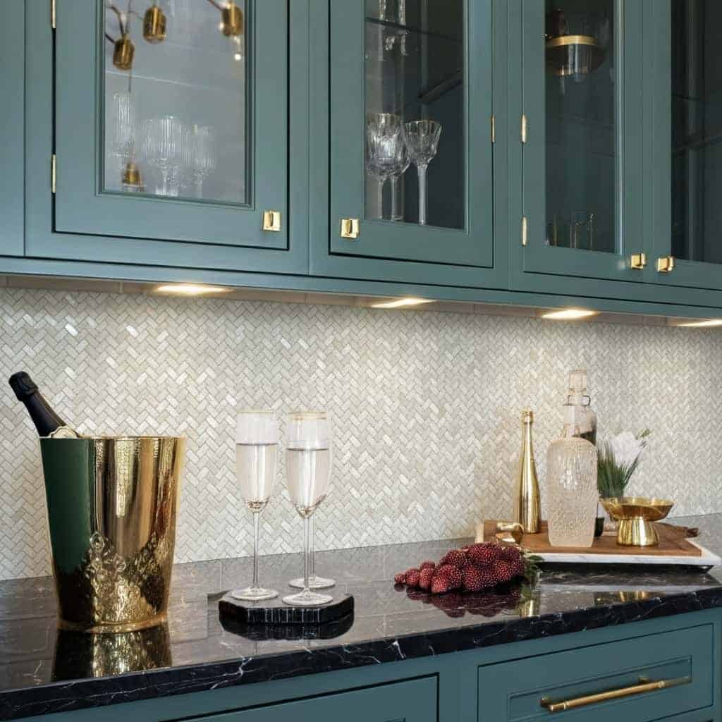 Elegant kitchen backsplash featuring mother of pearl shell tile with iridescent pearl and seashell accents.