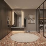 A close-up of terracotta tile flooring with warm earthy tones and geometric patterns, complemented by minimalist decor and mo.