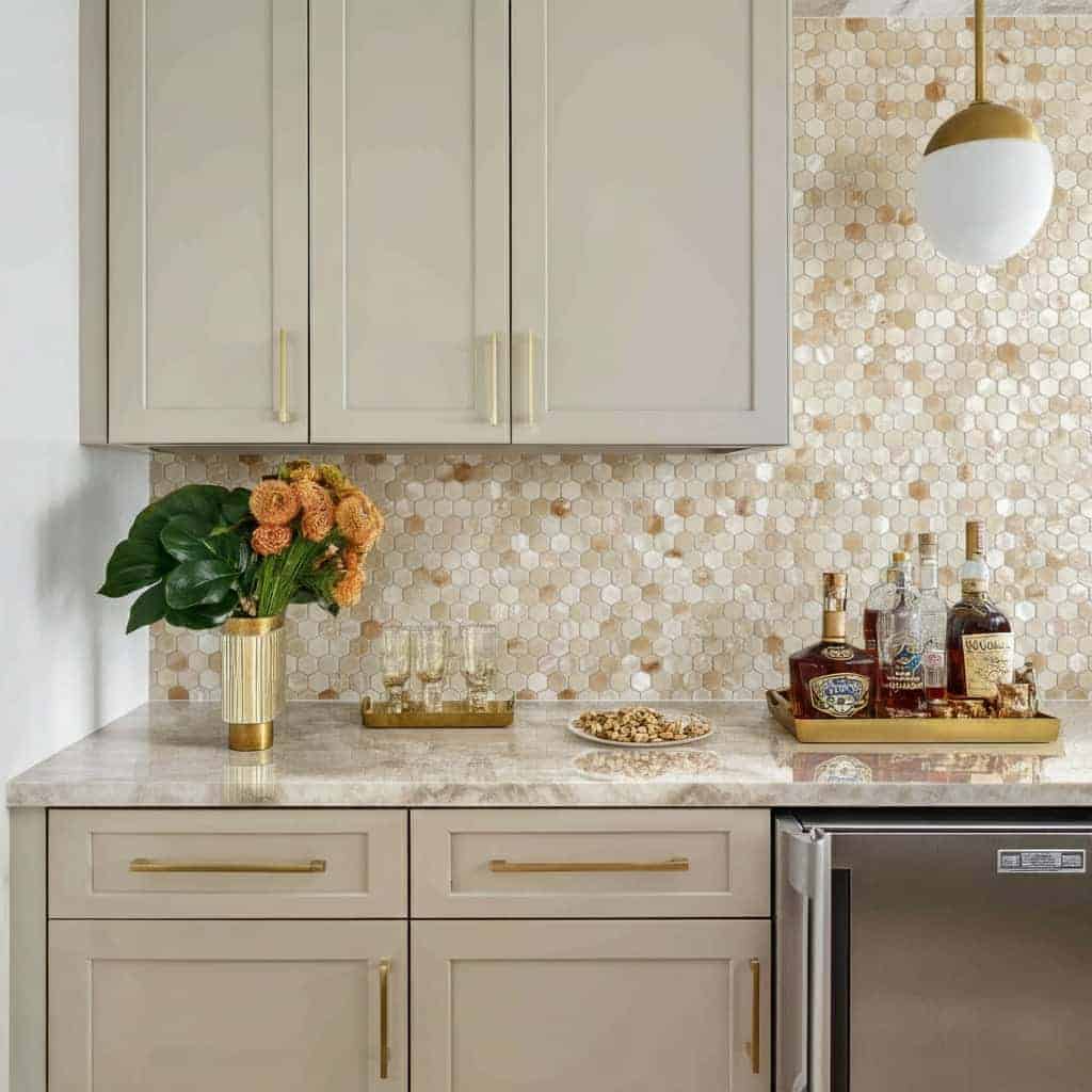 Beautiful shell tile backsplash with mother of pearl accents in a modern kitchen setting.