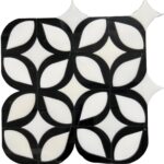 Black and white ceramic tile with a glossy finish and a leaf-like geometric pattern.
