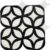 Black and white ceramic tile with a glossy finish and a leaf-like geometric pattern.