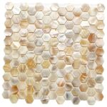 Up of hexagonal mother of pearl shell tiles showcasing iridescent, shimmering surfaces in a mosaic pattern.