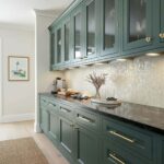 Elegant shell tile backsplash with mother of pearl accents in a modern kitchen setting.