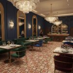 Interior view of a luxurious restaurant with deep blue walls, ornate mirrors, and a patterned tile floor, complemented by cha.