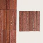 Red brick tile with textured surface and natural weathered look.