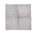 Light gray concrete tiles with smooth texture and matte finish.