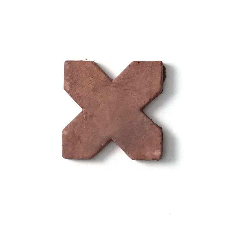 X-shaped tile in warm terracotta color with a matte, textured surface.