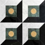 Black and green marble tiles with gold circle inlay, sleek textured surface, modern geometric design.
