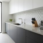 White and gray patterned tile backsplash in a modern kitchen.