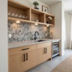 Bright kitchen featuring peel and stick wall tile, countertop, and open shelving.