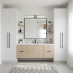 A modern bathroom vanity with peel and stick wall tiles, minimalist design, and natural wood accents for a sleek look.
