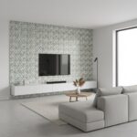 Modern gray geometric patterned tile wall with textured surface in a contemporary living room setting.