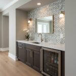 Geometric patterned tile in shades of blue, gray, and white, with a smooth texture. Features dark wood cabinetry, gold hardwa.