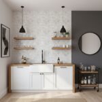 Mother of pearl shell tile backsplash in a modern kitchen with white cabinetry and floating wooden shelves.