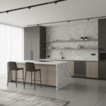A sleek kitchen featuring shell tile backsplash, modern cabinetry, and a marble island in a contemporary home.