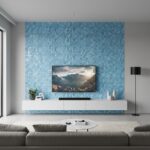 Blue seashell mosaic tile wall behind TV in contemporary living room setting.
